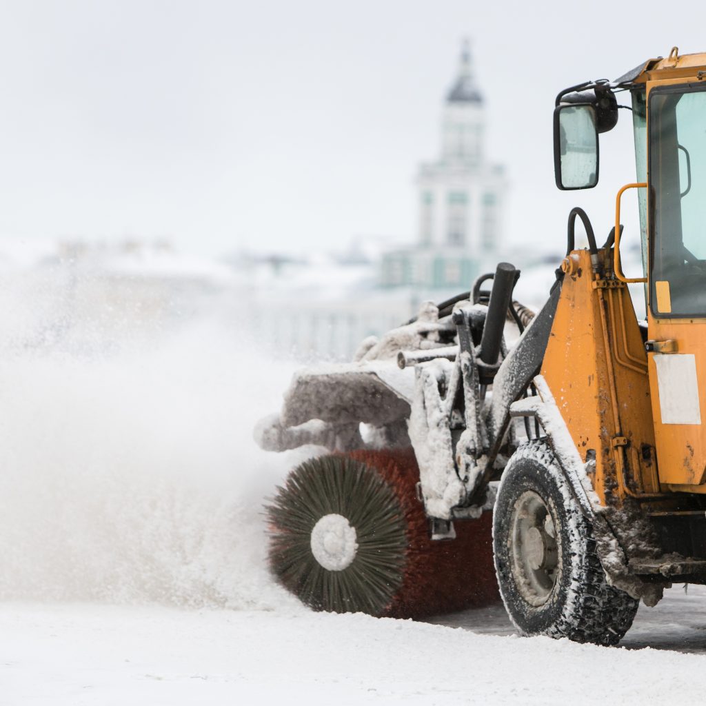 Snowplow truck vehicle removing snow after blizzard/snowstorm